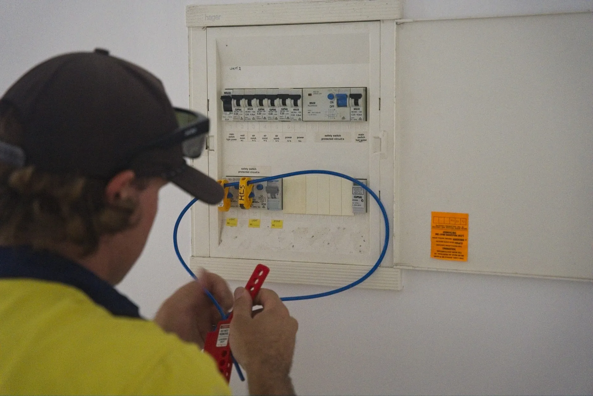Coast electrician testing a distribution board